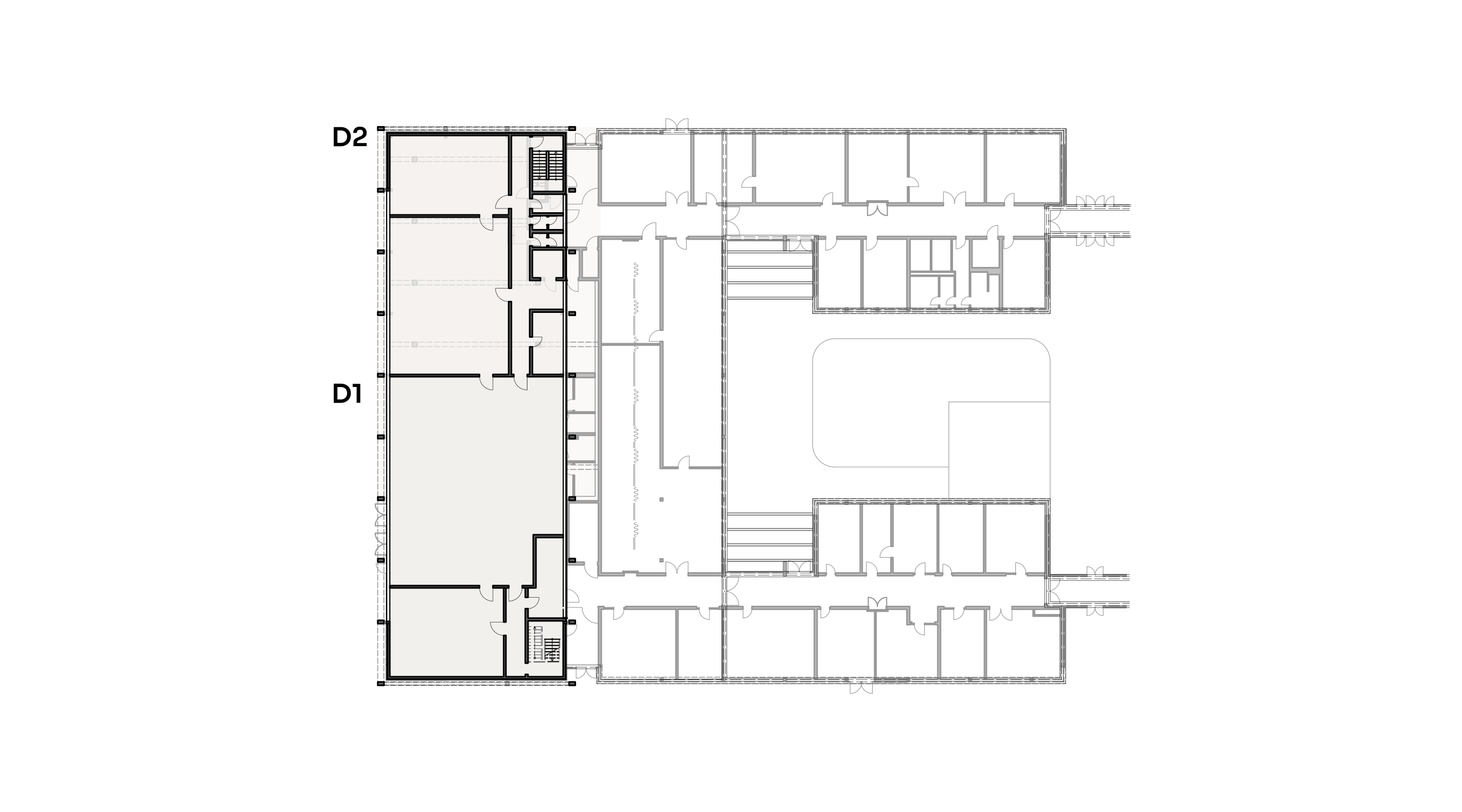Architektonischer Grundriss eines Gebäudeteils mit mehreren Räumen, Fluren und Treppenhäusern.